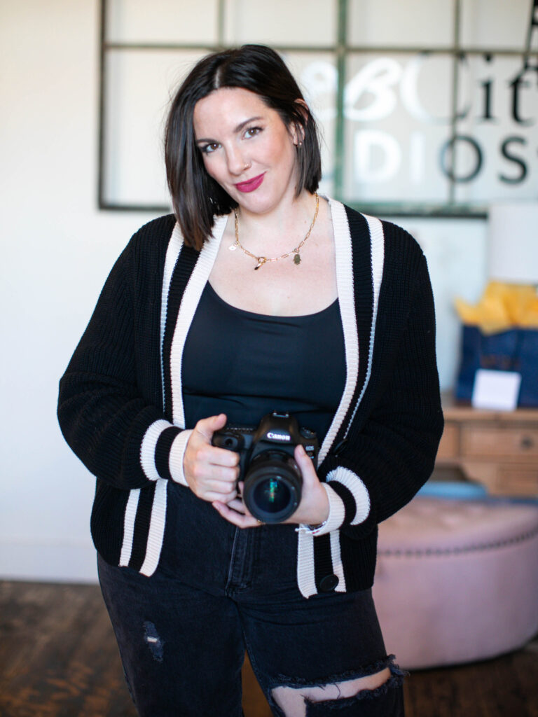 jess Jones Boudoir, a photographer, standing with her camera